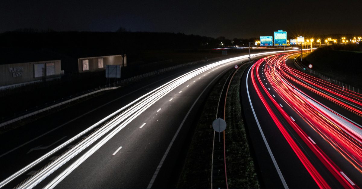 Long exposure photograph showing streaks of light from car lights on a freeway